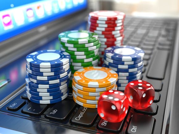 Casino chips seen on a laptop keyboard.