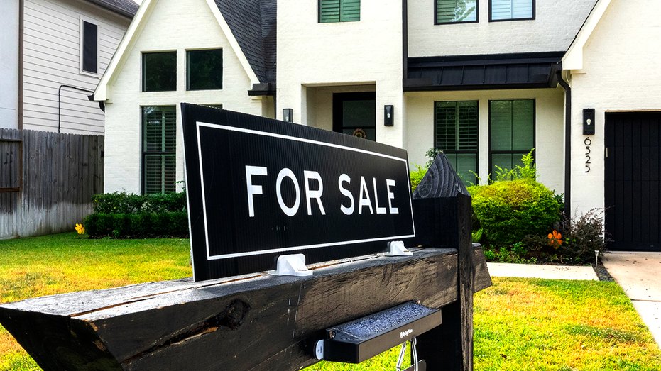 For sale sign in front of a house
